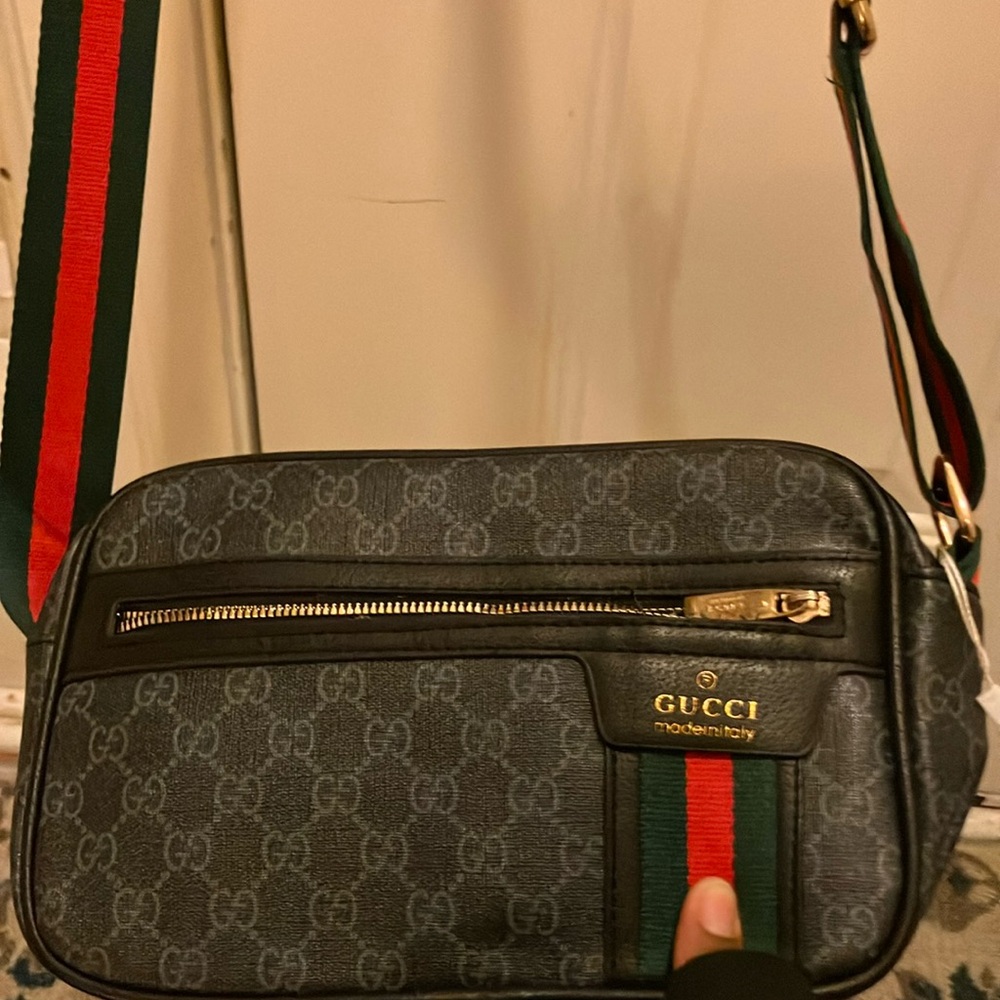 I’m selling a Crossbody, black Gucci purse.